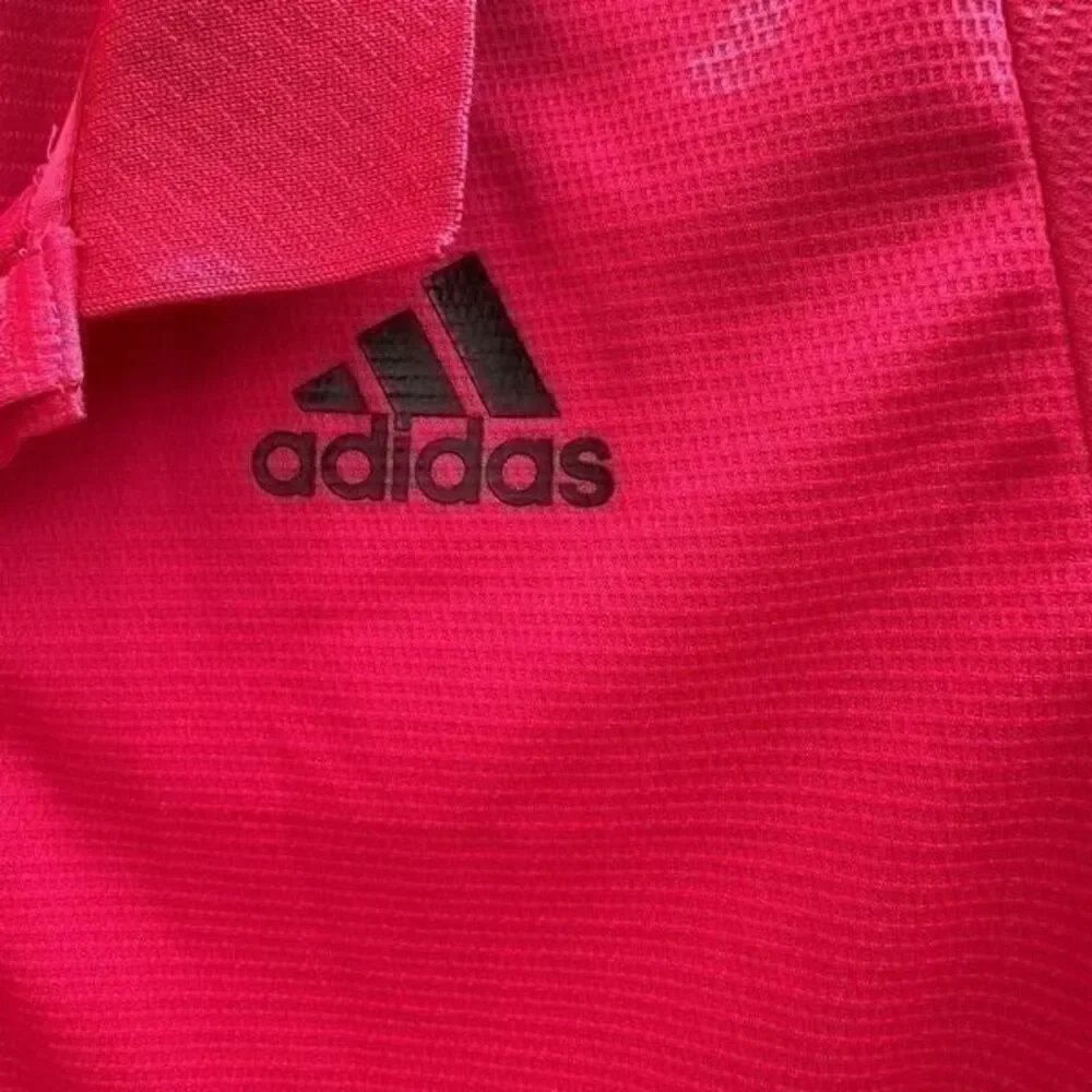 Adidas freelift polo color raspberry size S. A424
